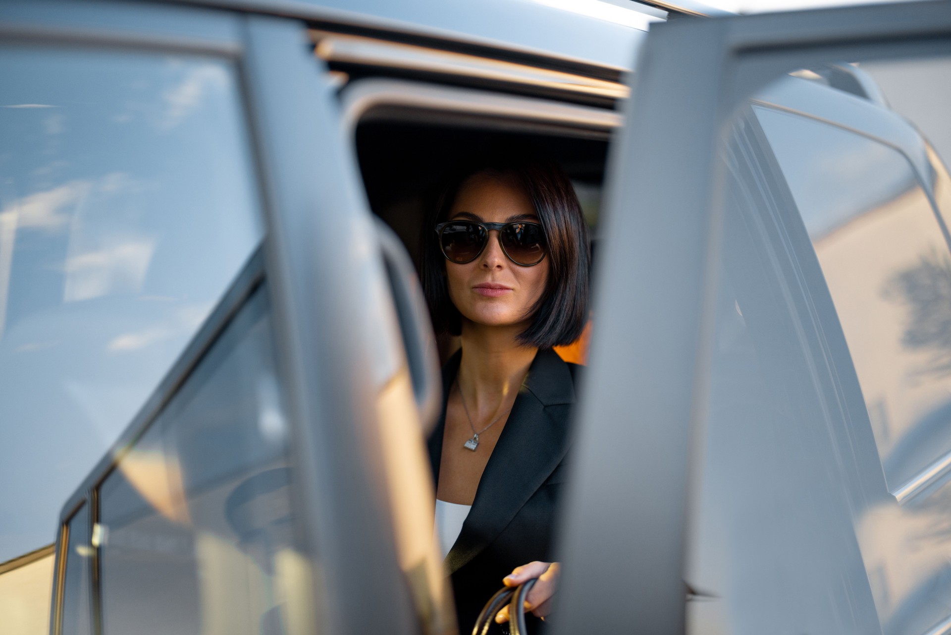 Portrait of an elegant business lady in car