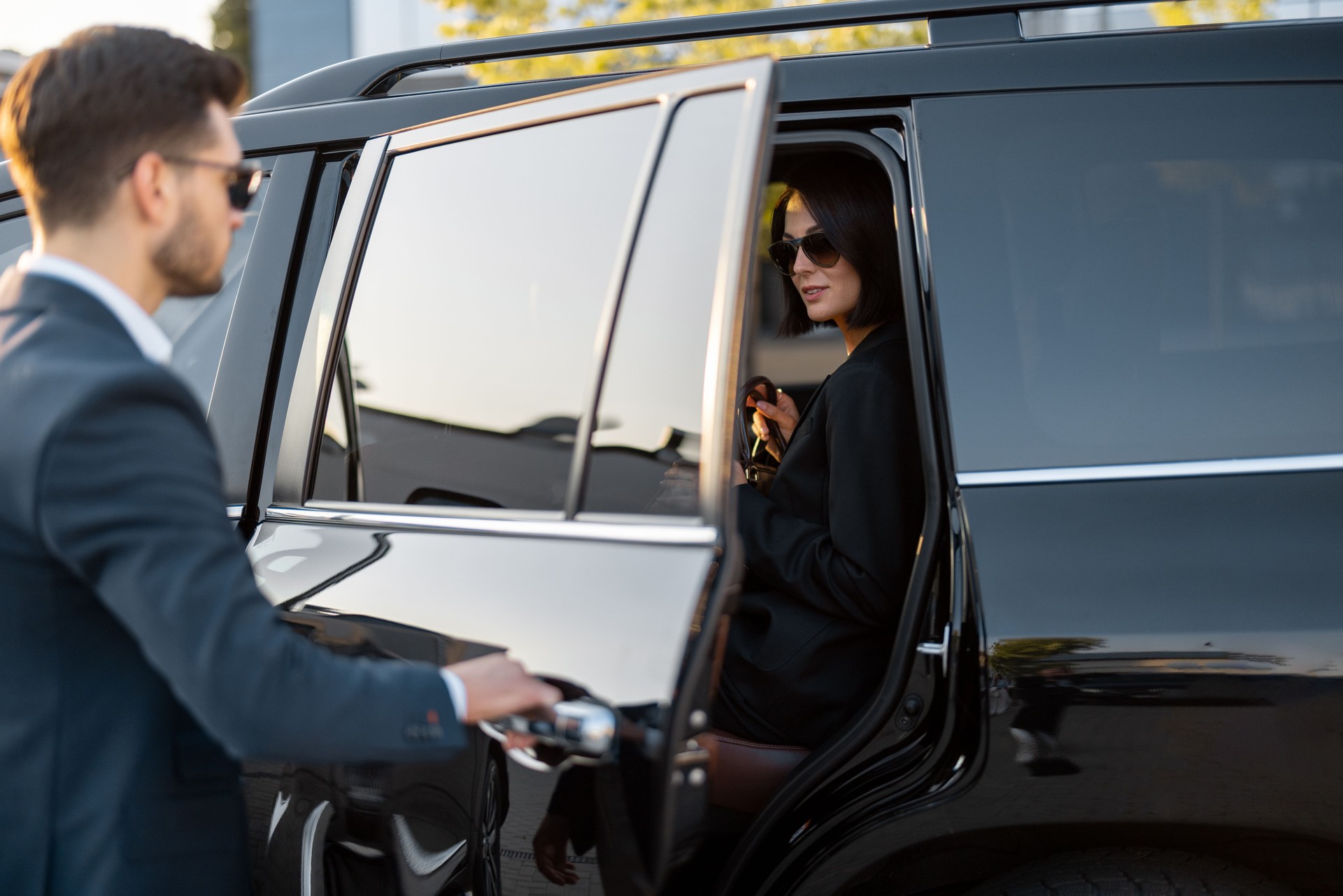 Business couple travel by car
